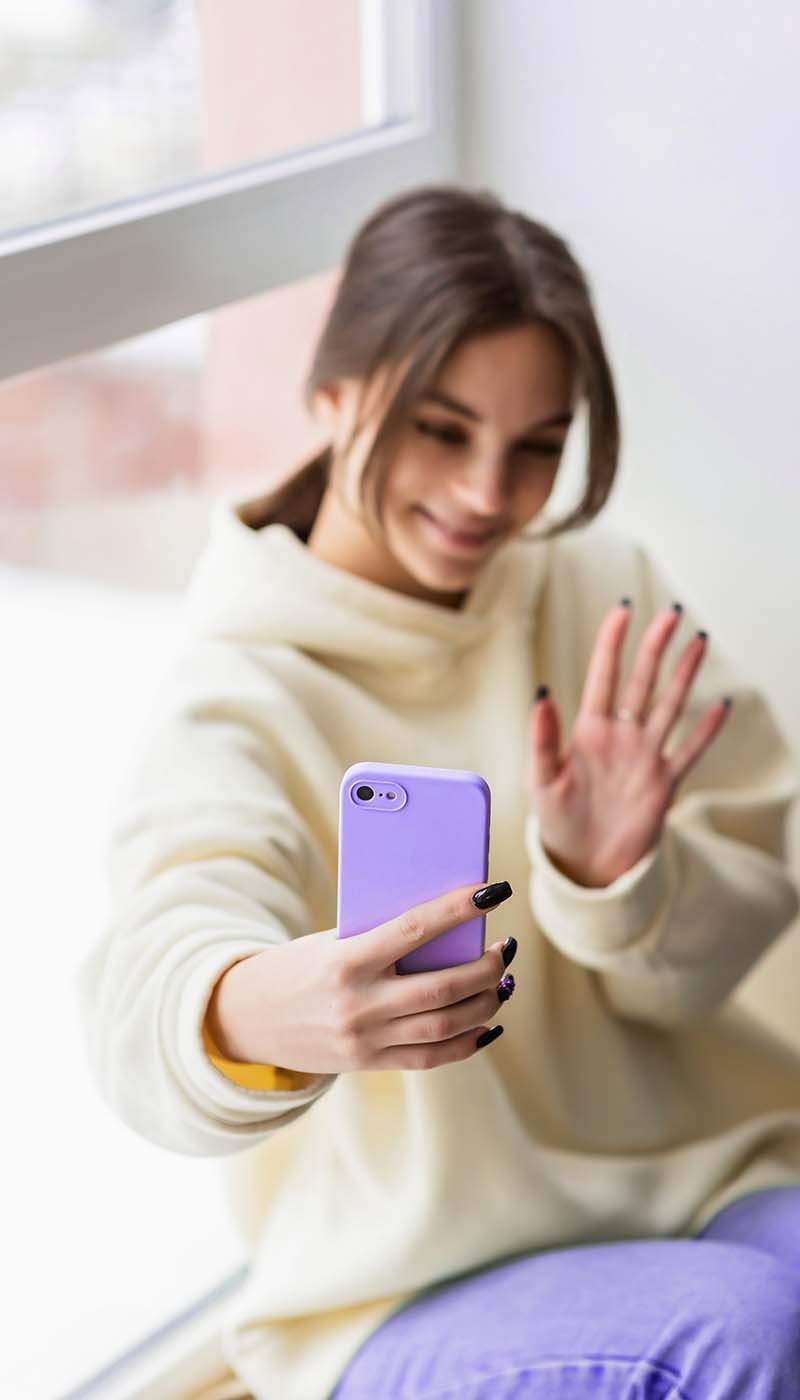 happy-female-blogger-taking-selfie-portrait-on-sma-JJ9WRFY.jpg